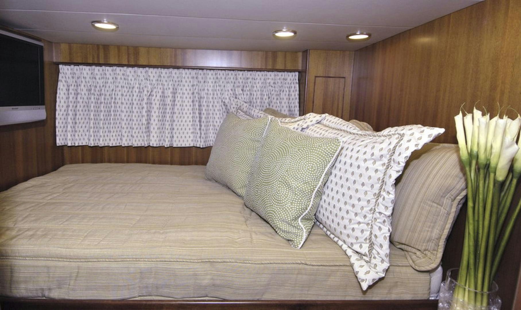 a bed with pillows aboard HATT TRICK Yacht for Sale