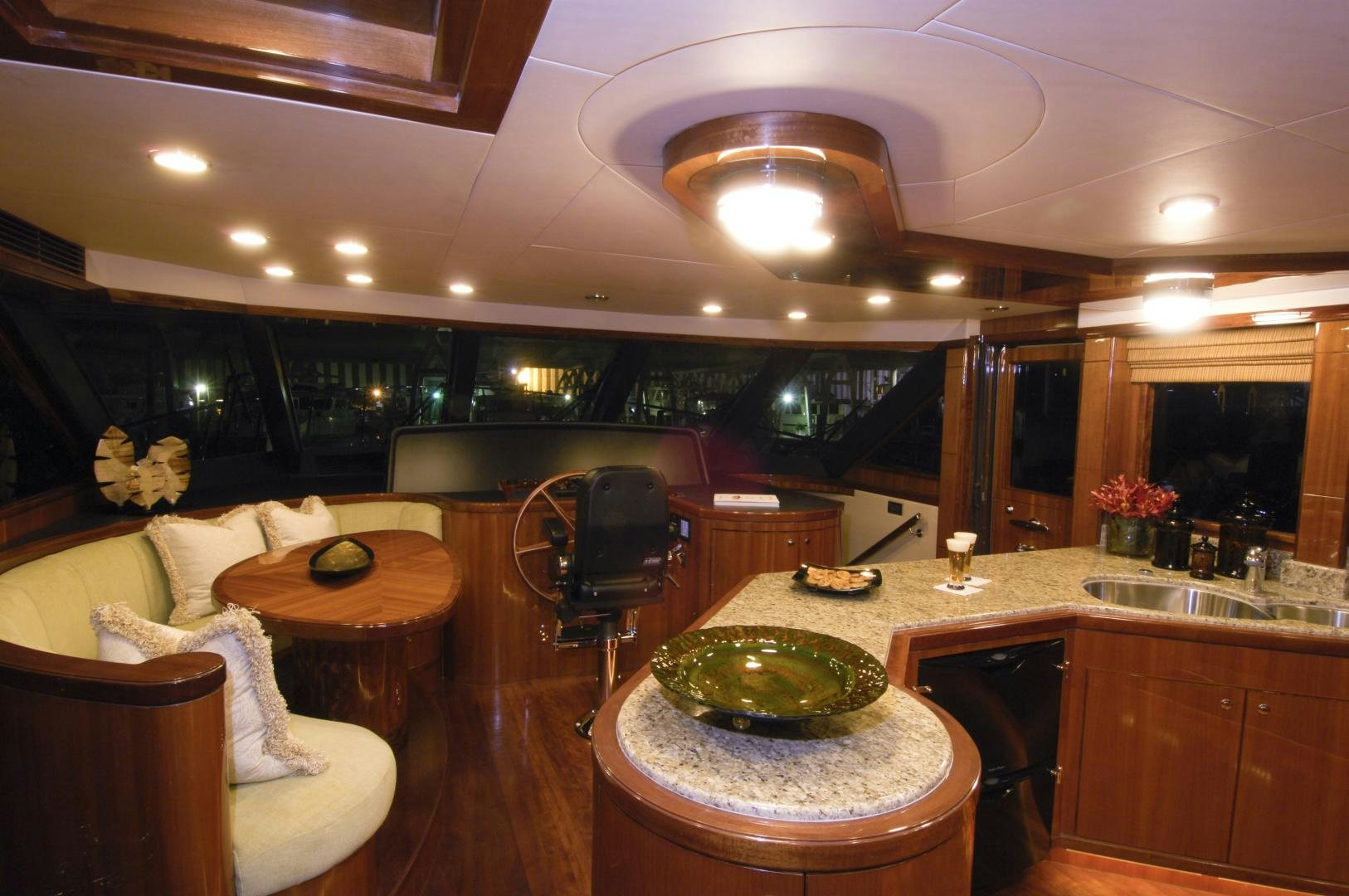 a kitchen with a large table and chairs aboard HATT TRICK Yacht for Sale