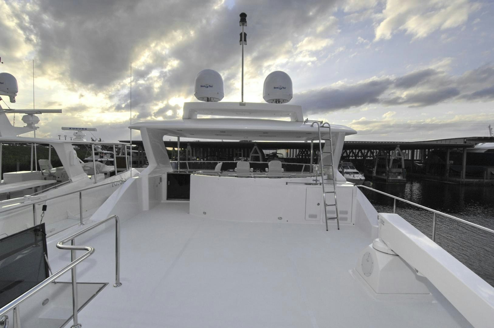 a large white boat on a snowy dock aboard HATT TRICK Yacht for Sale