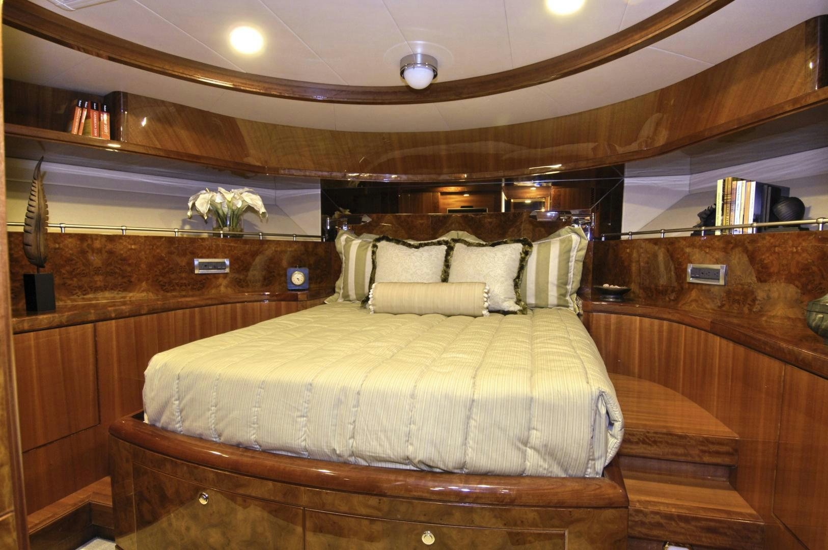 a bed with a white comforter aboard HATT TRICK Yacht for Sale