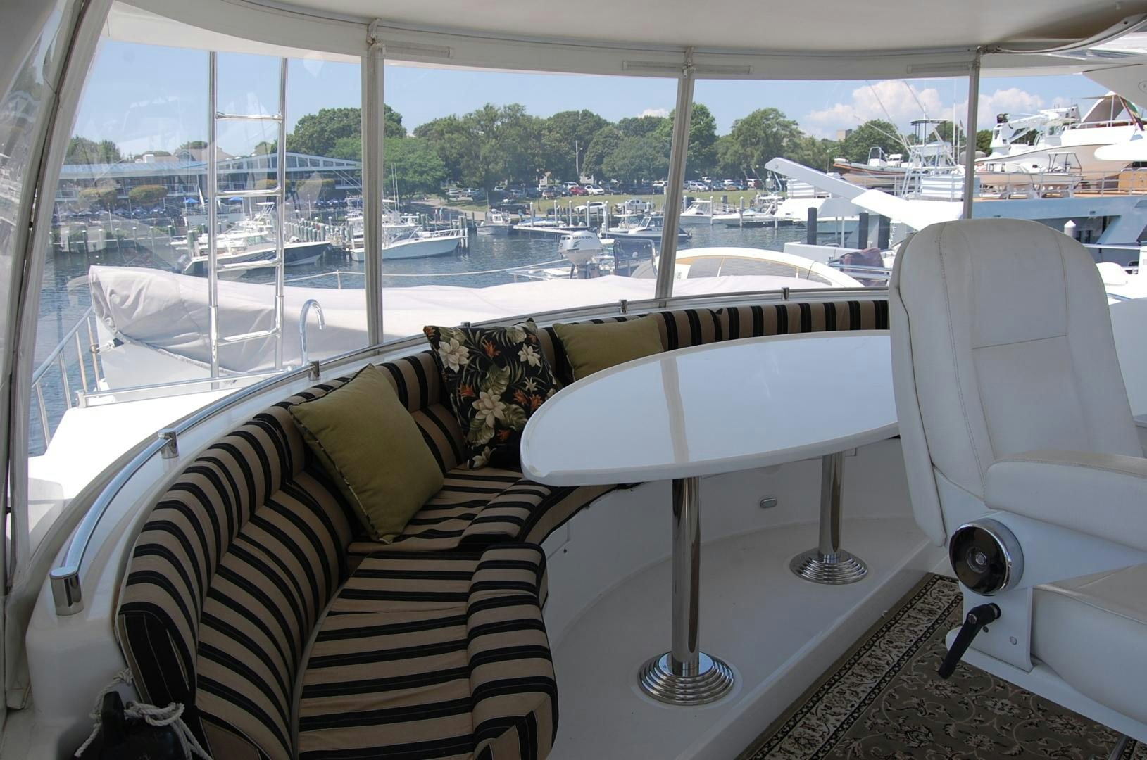 a room with a table and chairs aboard HATT TRICK Yacht for Sale