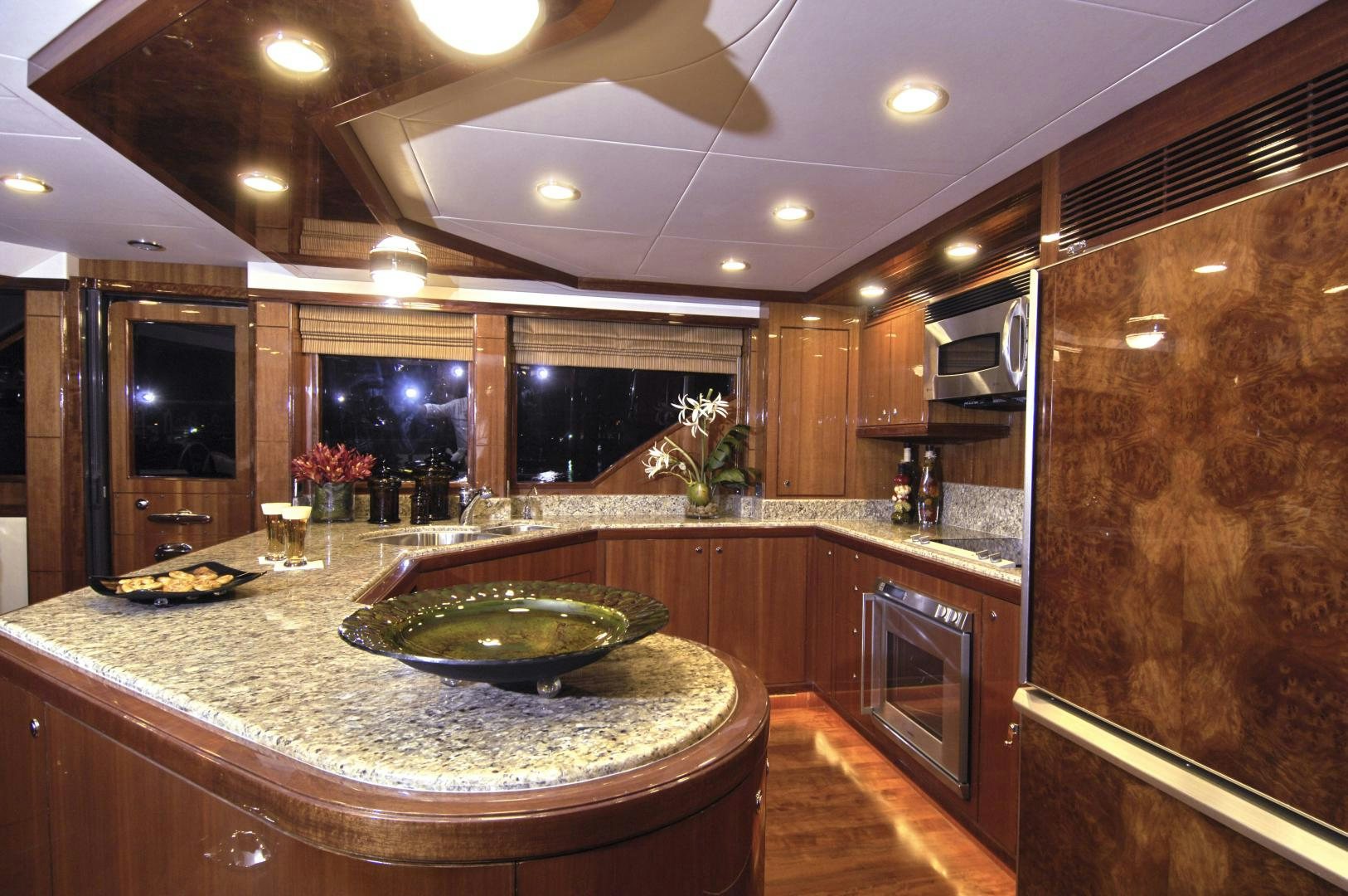 a kitchen with a large island aboard HATT TRICK Yacht for Sale