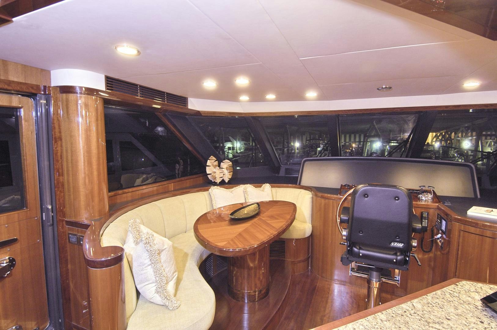 a room with a table and chairs aboard HATT TRICK Yacht for Sale