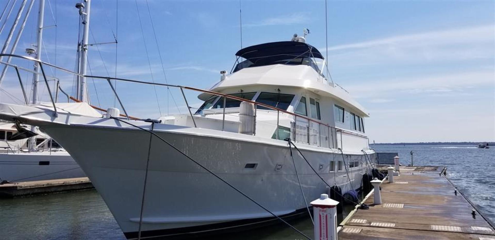 a large white boat docked at a pier aboard CAROLINA WIND Yacht for Sale
