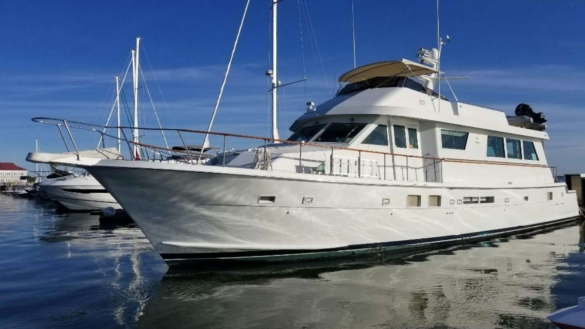 a large white boat in the water aboard CAROLINA WIND Yacht for Sale