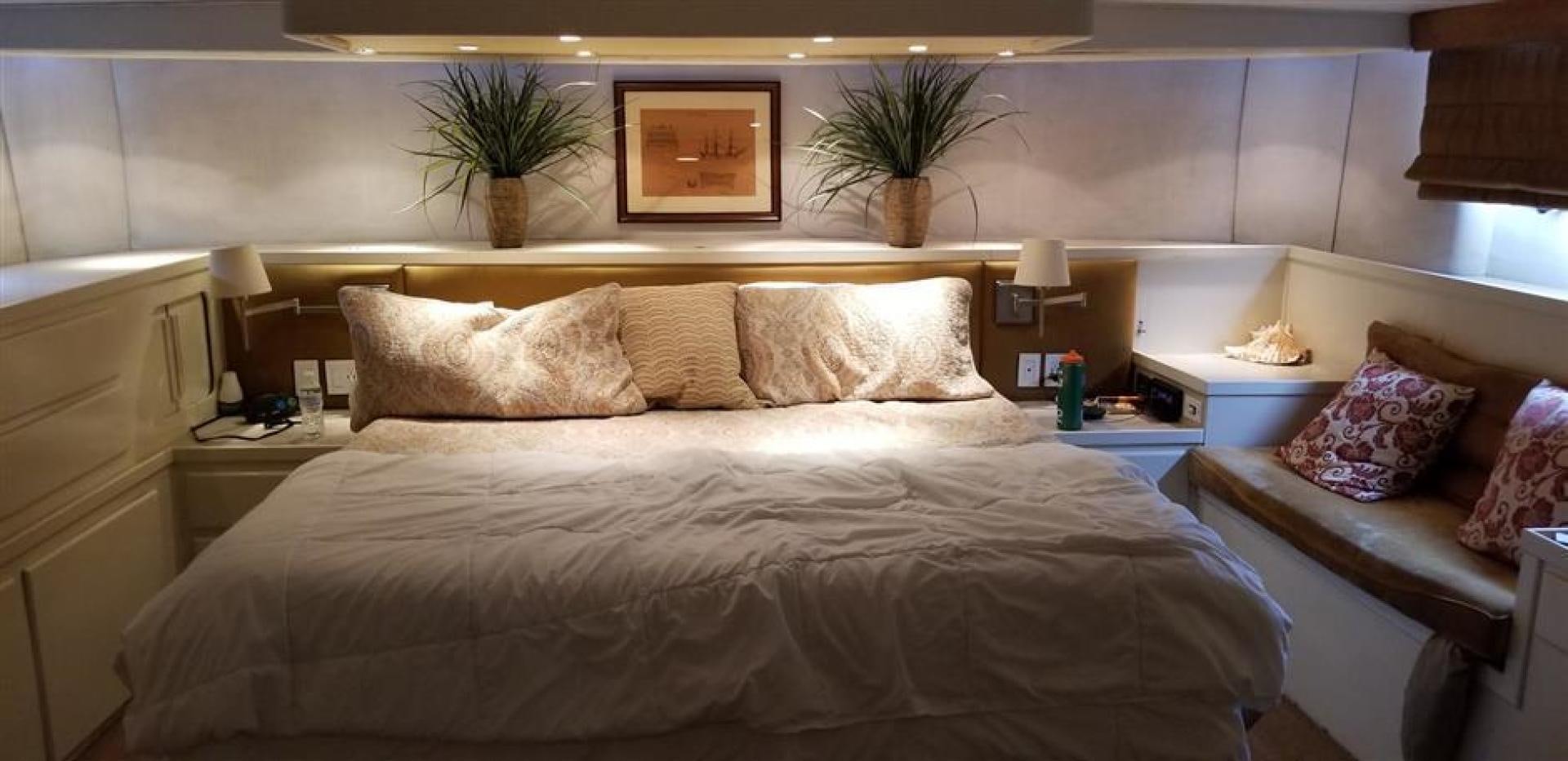 a bed with a flowered pillow aboard CAROLINA WIND Yacht for Sale