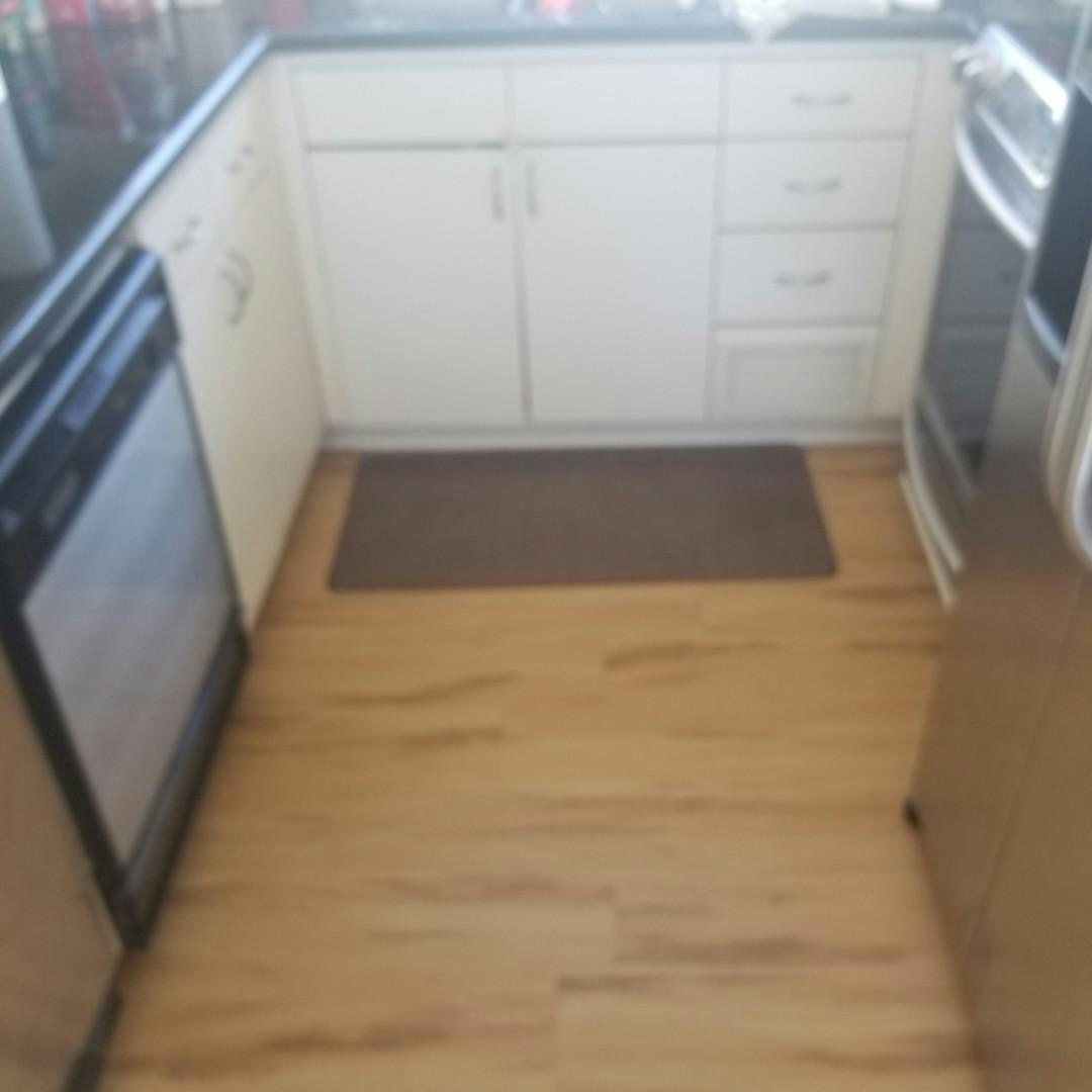 a kitchen with white cabinets aboard CAROLINA WIND Yacht for Sale