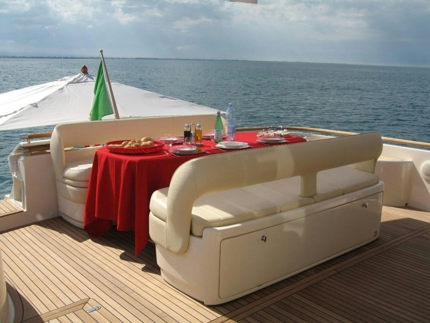 a table on a balcony aboard No Name Yacht for Sale