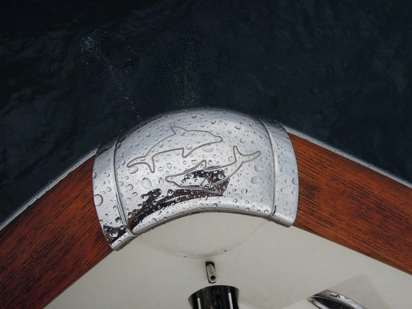 a white toilet with a black wall aboard No Name Yacht for Sale