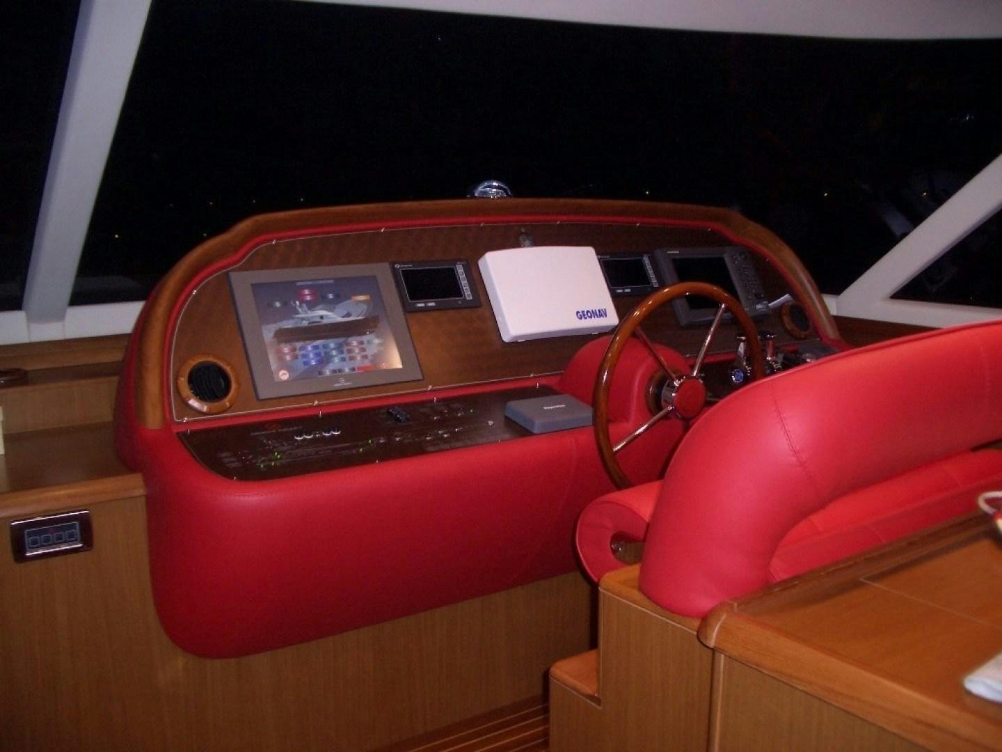 a red car with a keypad aboard No Name Yacht for Sale