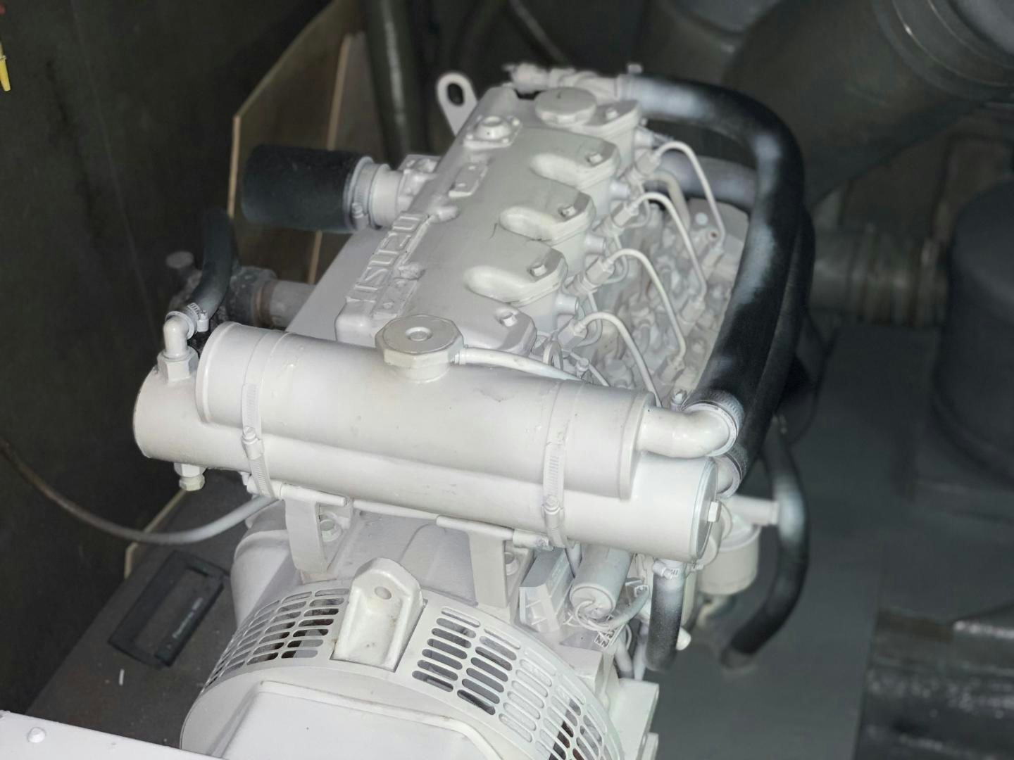 a car engine with a white hood aboard No Name Yacht for Sale