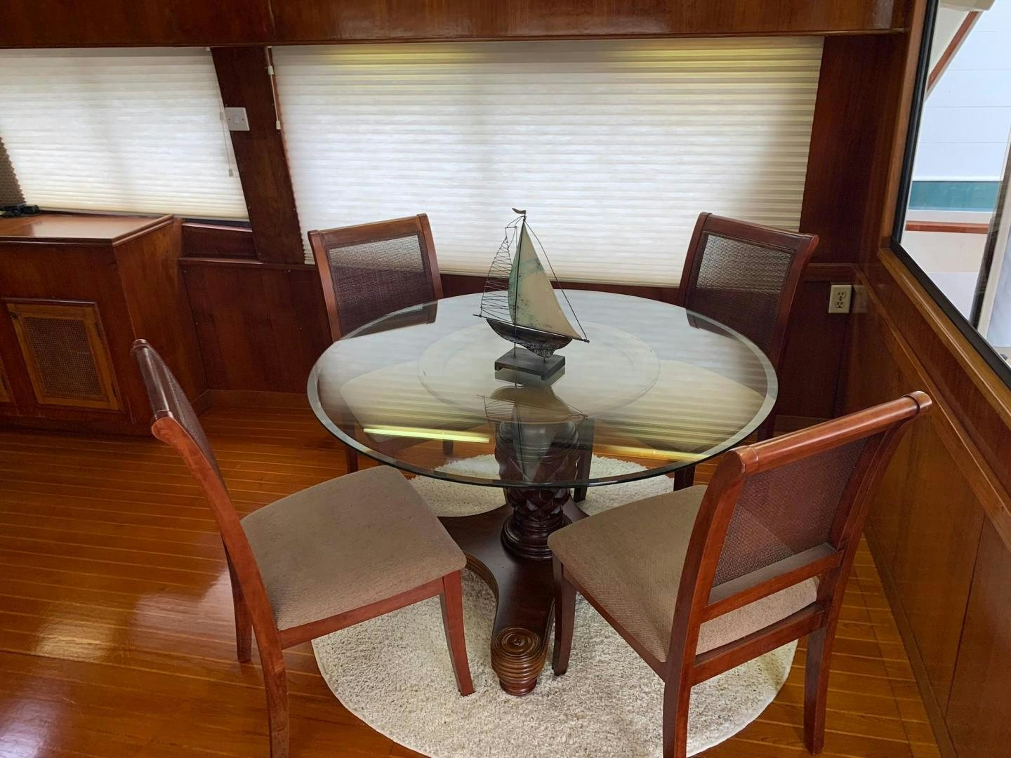 a table with chairs around it aboard No Name Yacht for Sale