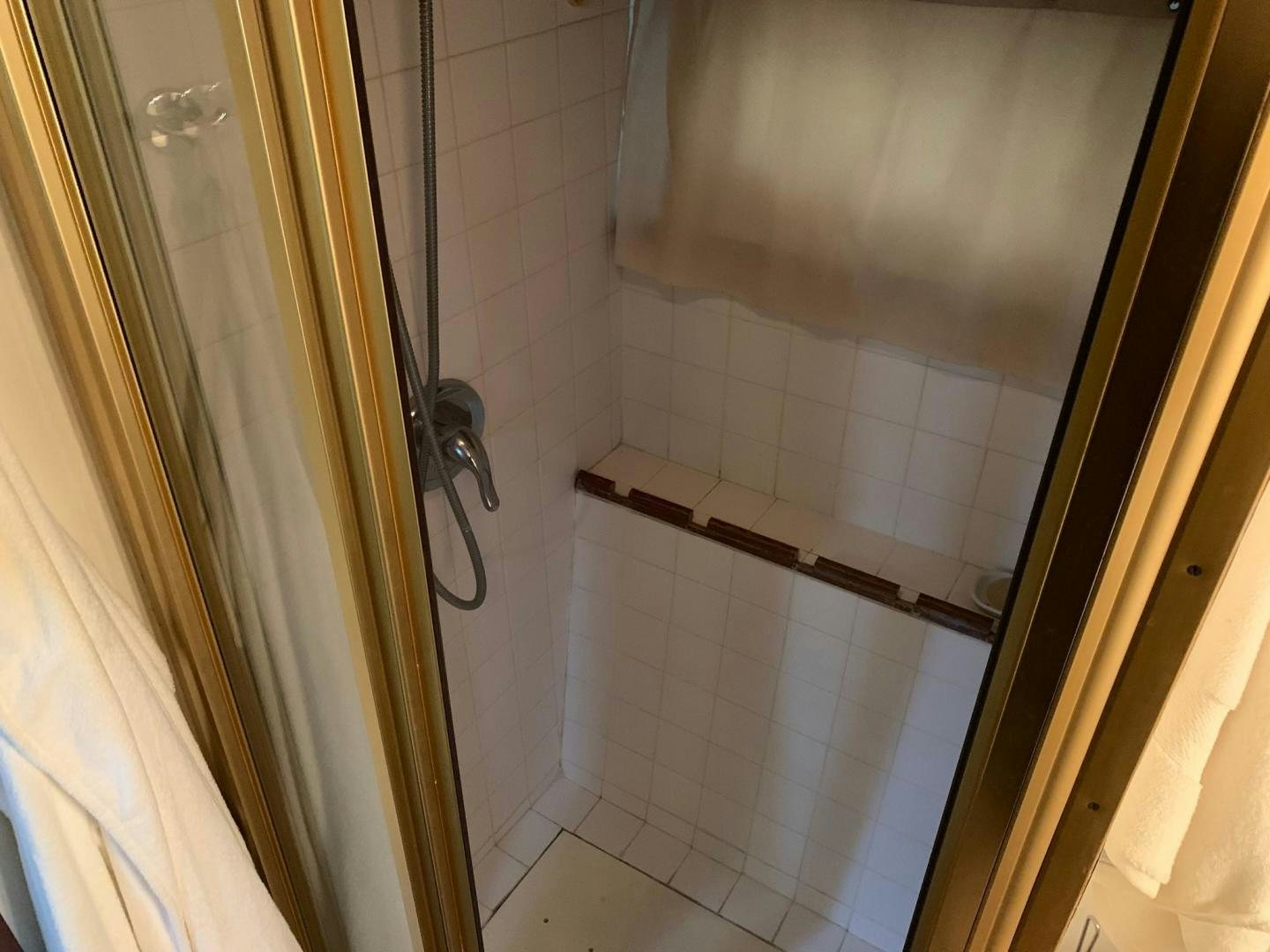 a bathroom with a shower aboard No Name Yacht for Sale
