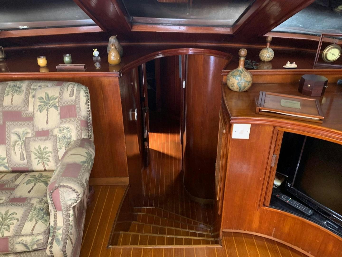 a room with a wood cabinet and a rug aboard No Name Yacht for Sale
