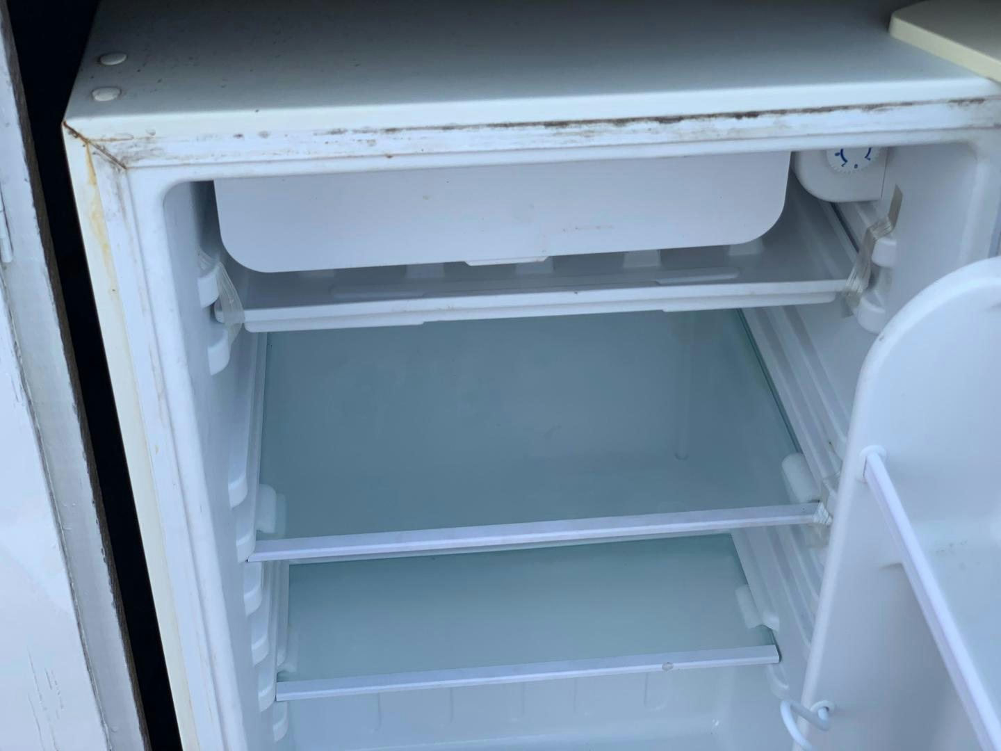 a white cabinet with drawers aboard No Name Yacht for Sale