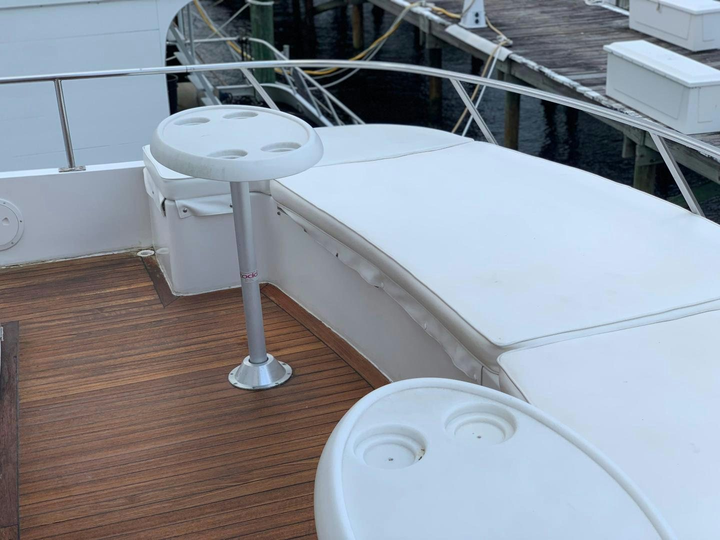 a white table with a white chair aboard No Name Yacht for Sale