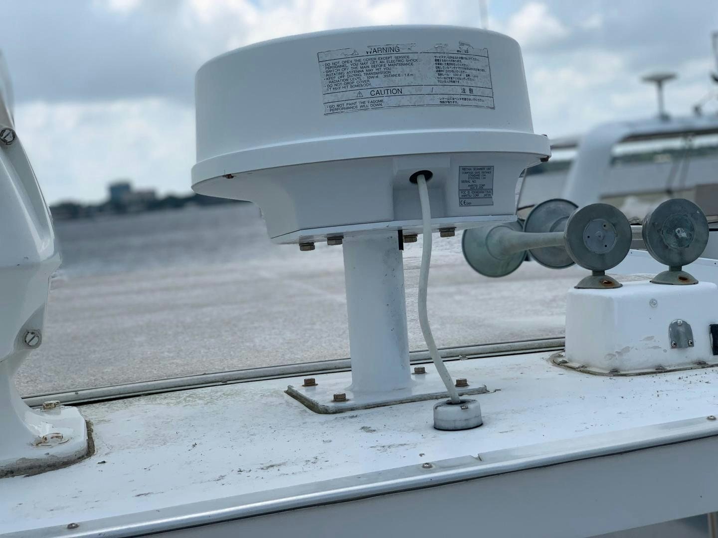 a white machine on a road aboard No Name Yacht for Sale