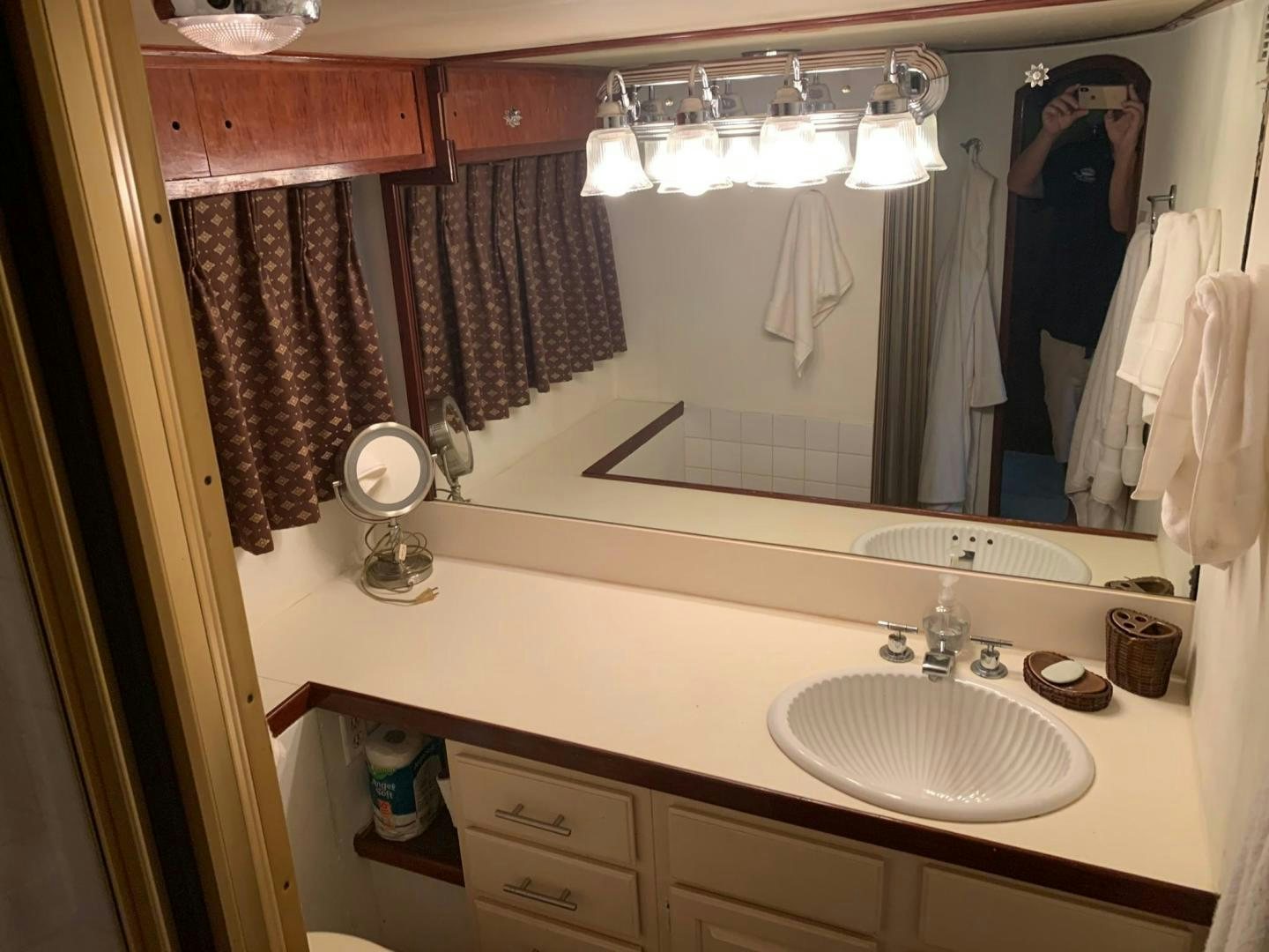 a bathroom with a sink and mirror aboard No Name Yacht for Sale