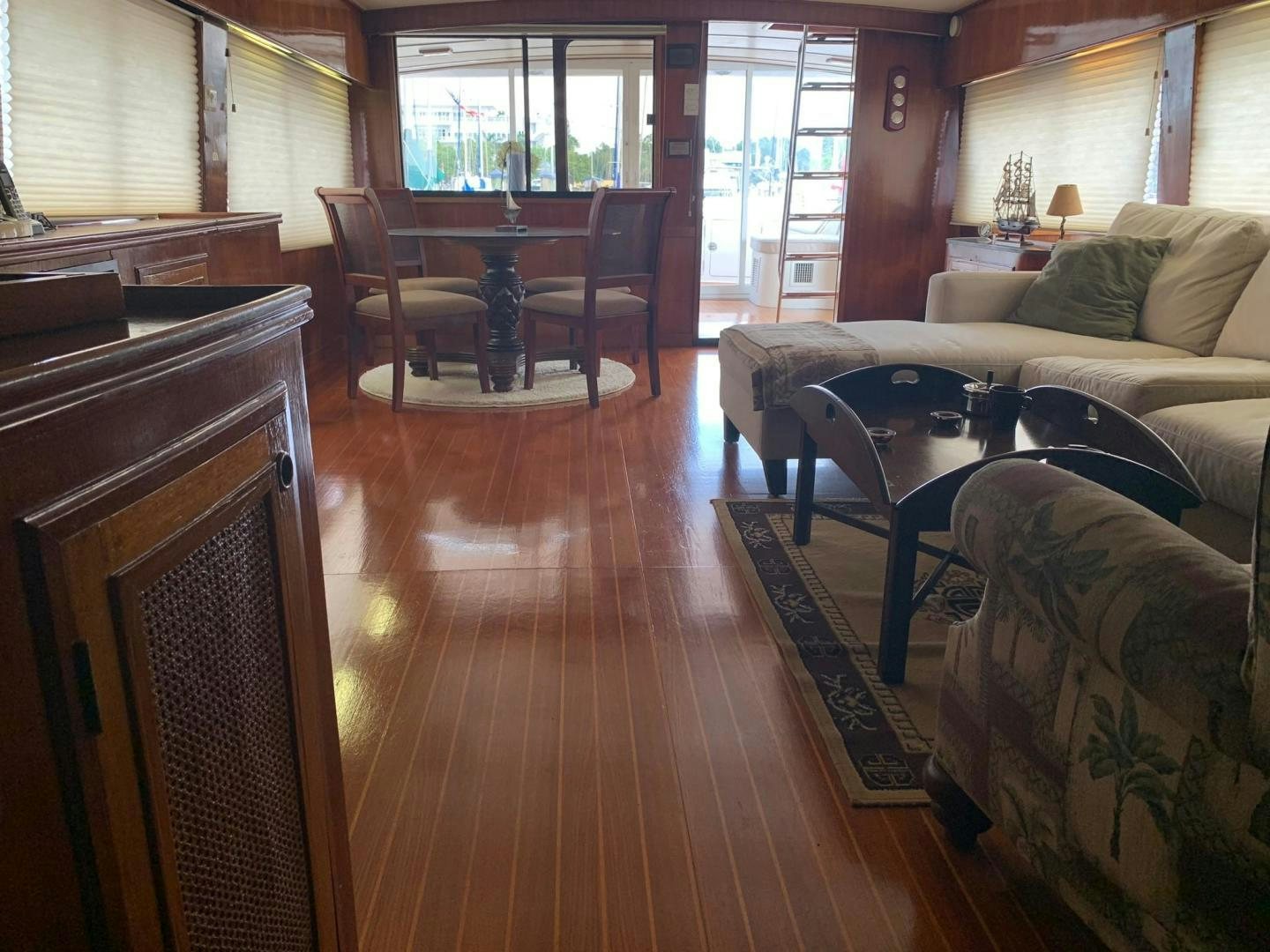 a living room with a table and chairs aboard No Name Yacht for Sale
