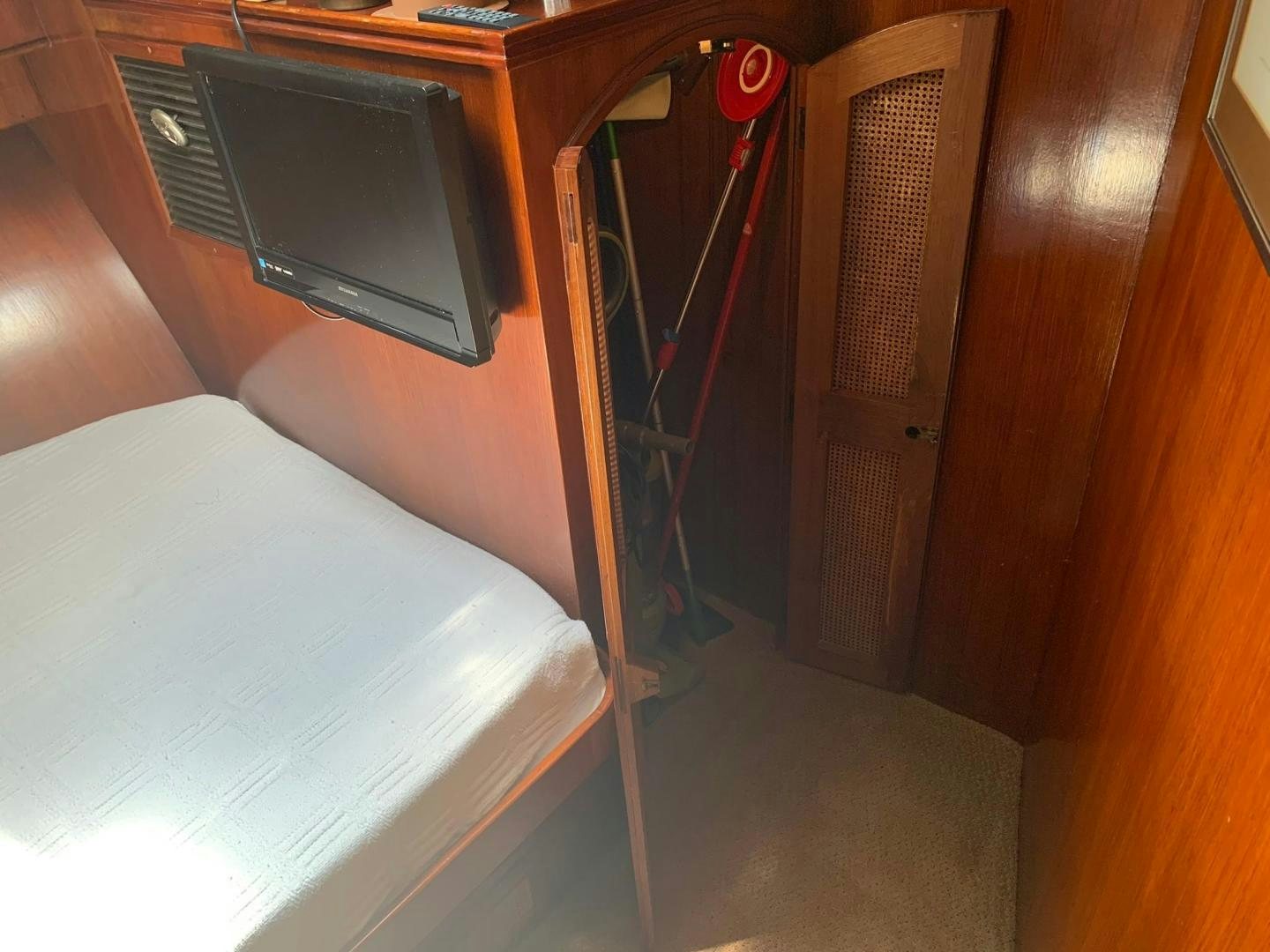 a bed in a room aboard No Name Yacht for Sale