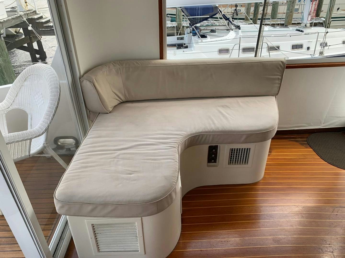 a couch in a room aboard No Name Yacht for Sale