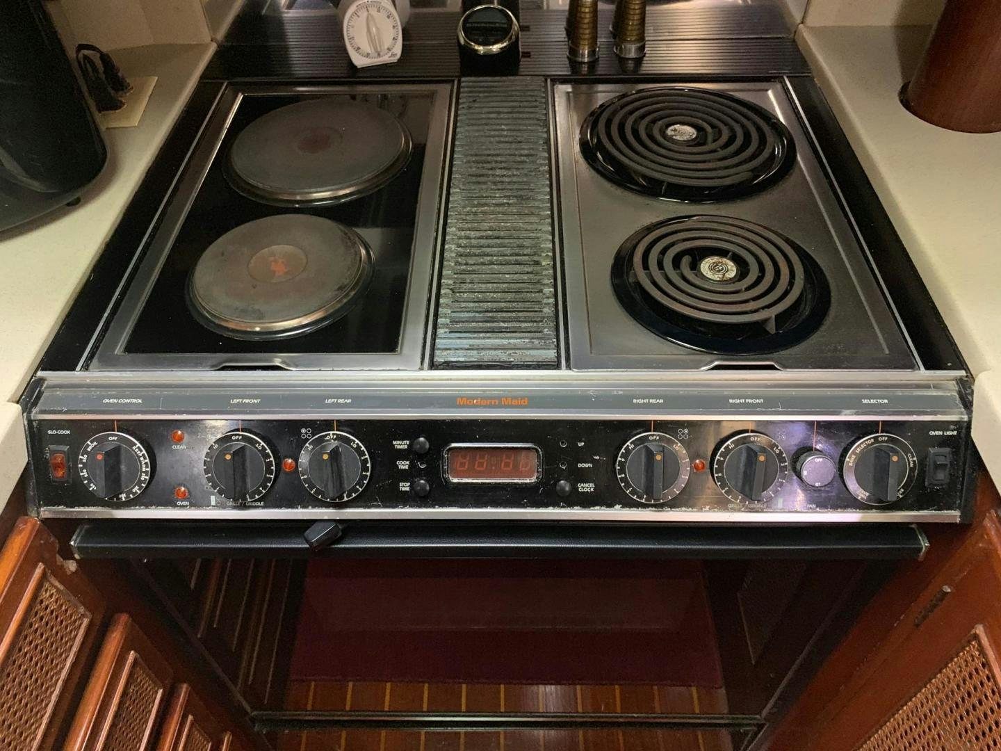 a stove with a pan on it aboard No Name Yacht for Sale
