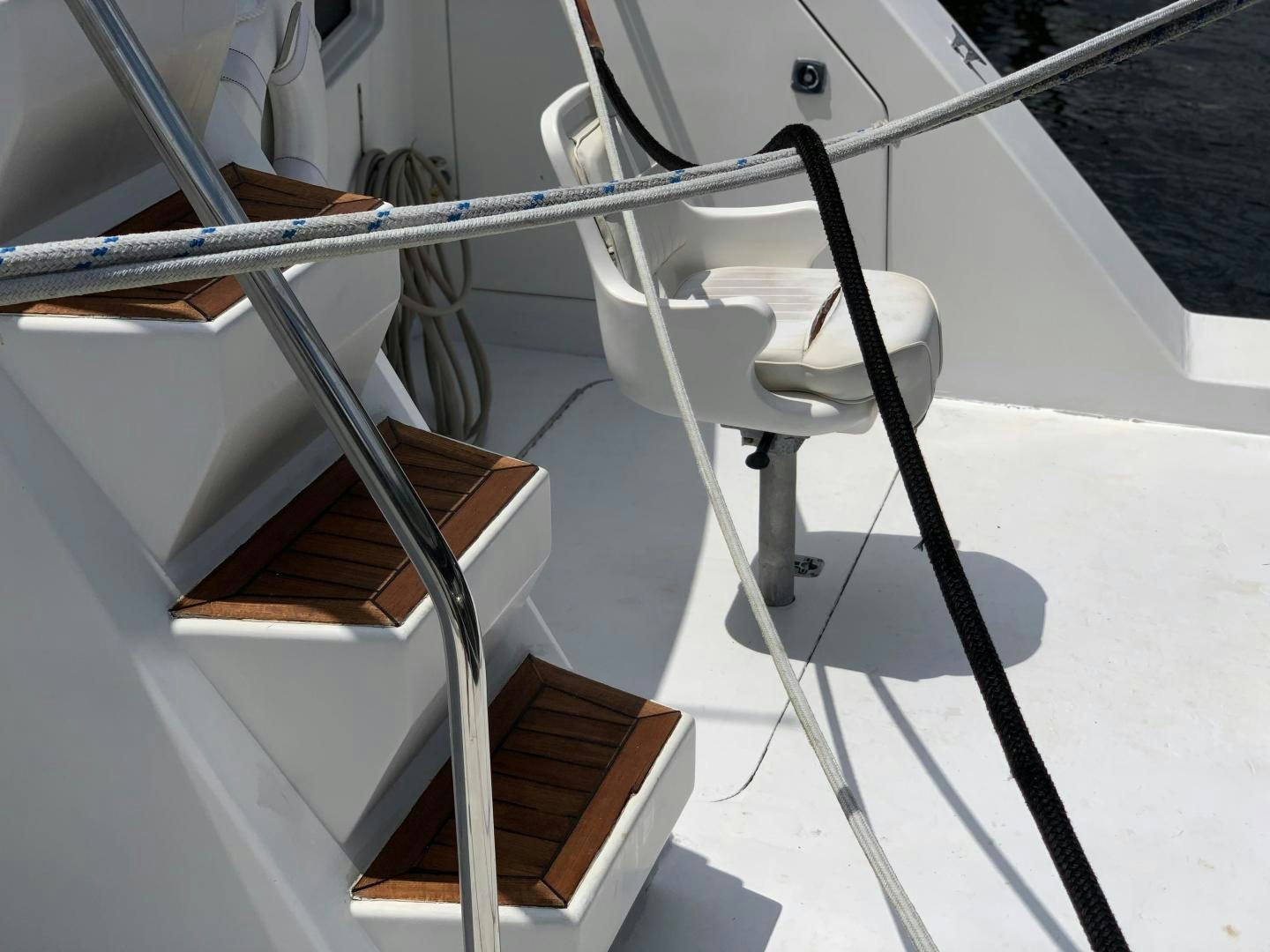 a white chair on a white surface aboard No Name Yacht for Sale