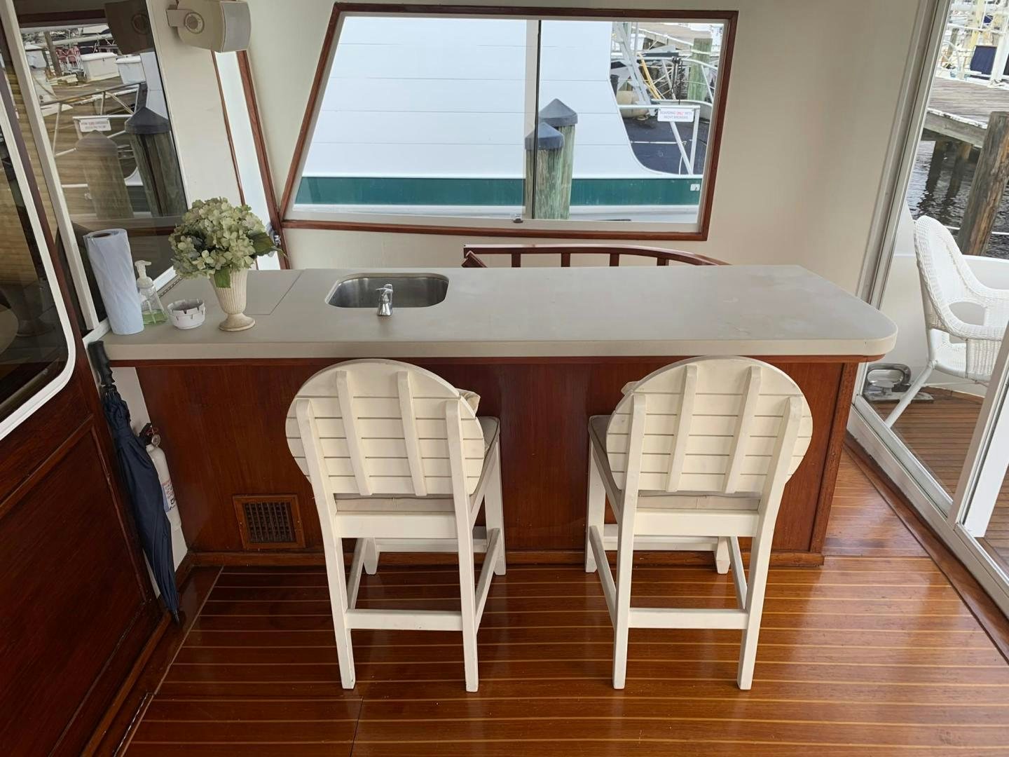 a kitchen with a table and chairs aboard No Name Yacht for Sale