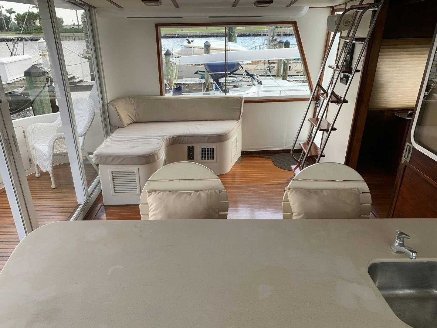 a room with a table and chairs aboard No Name Yacht for Sale