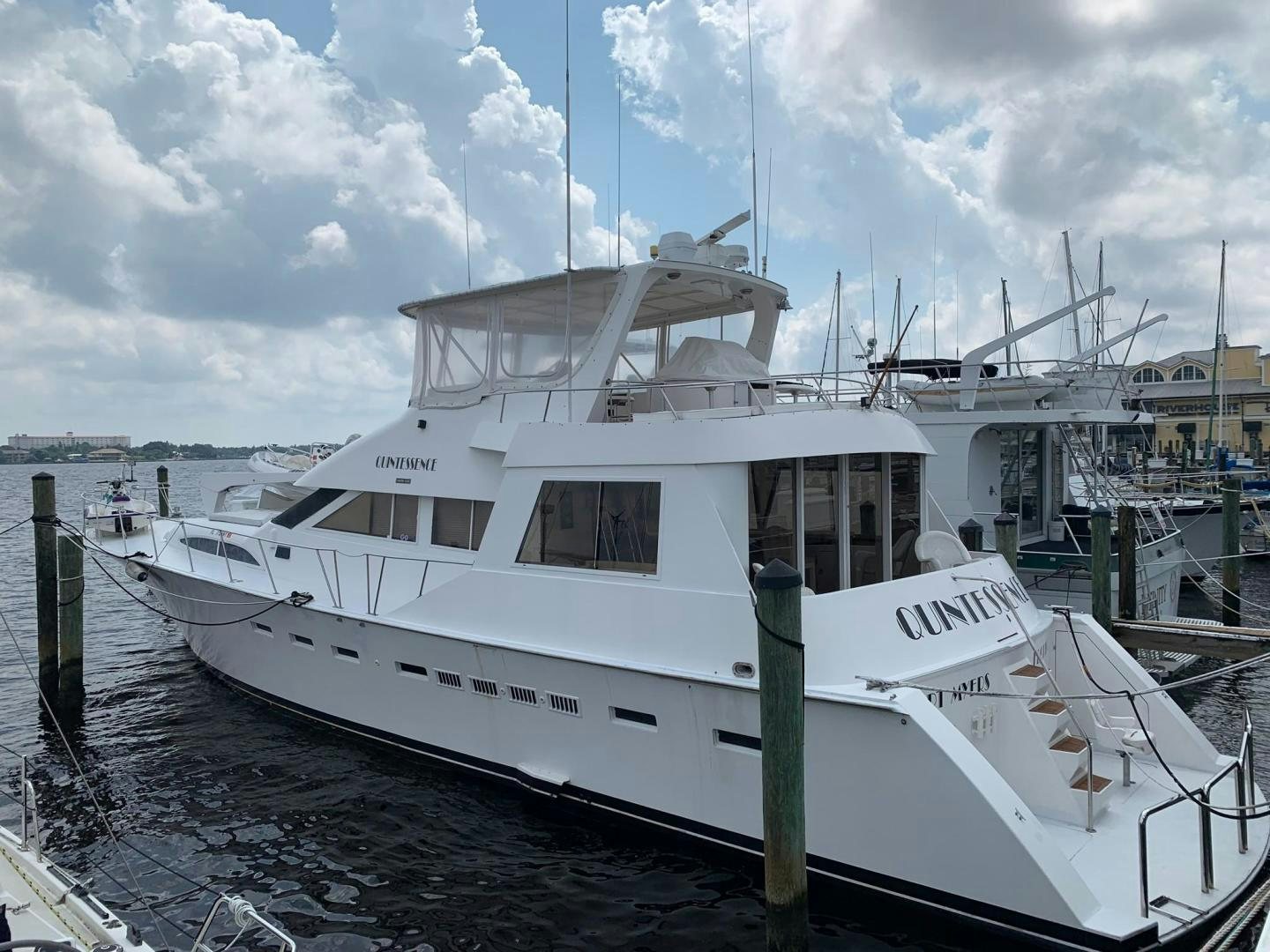 a white boat in a harbor aboard No Name Yacht for Sale