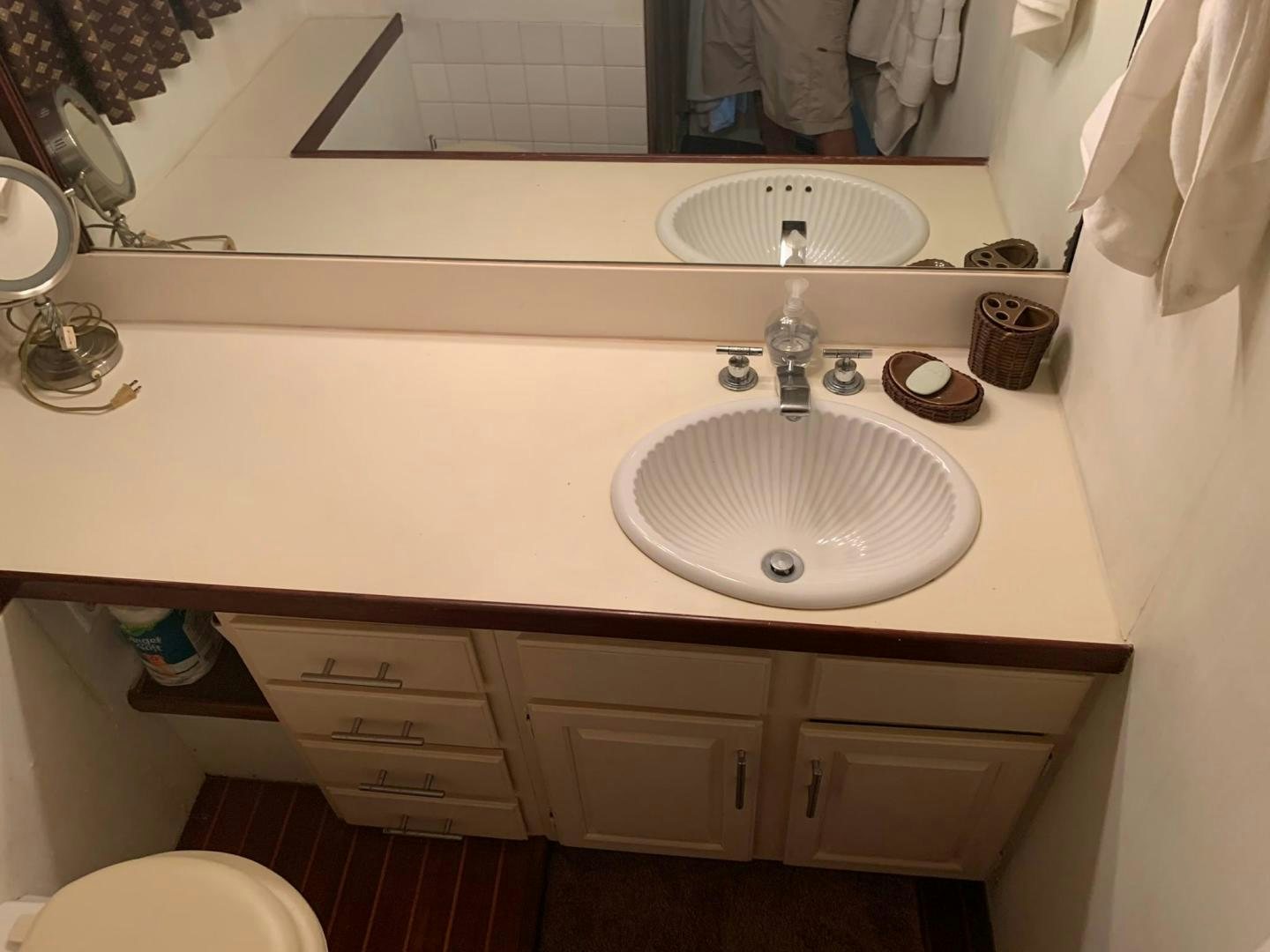 a bathroom with a sink and a mirror aboard No Name Yacht for Sale