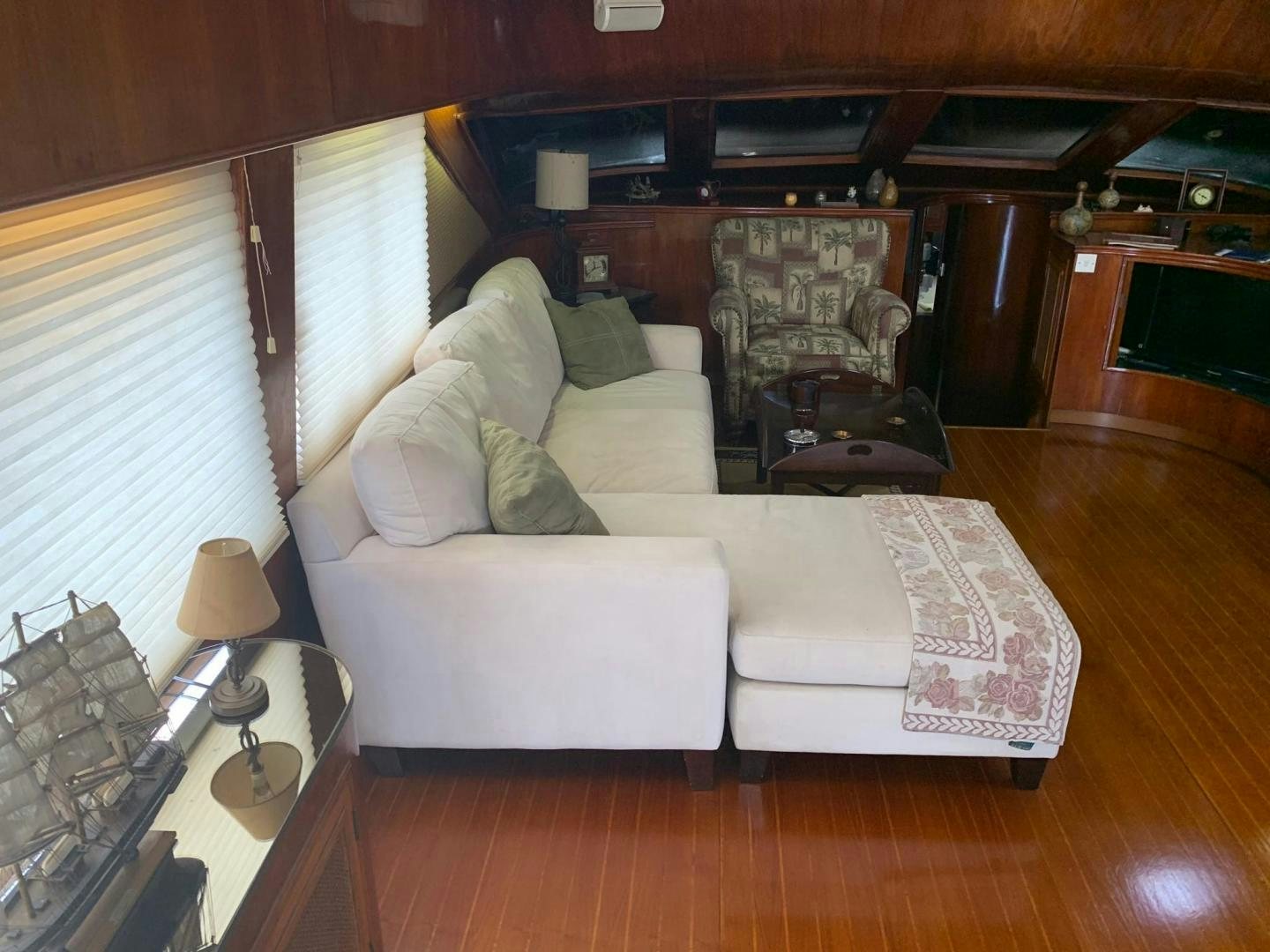 a living room with a couch aboard No Name Yacht for Sale