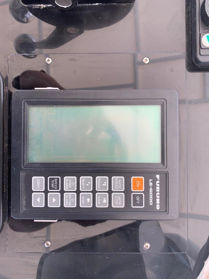 a small rectangular electronic device aboard No Name Yacht for Sale