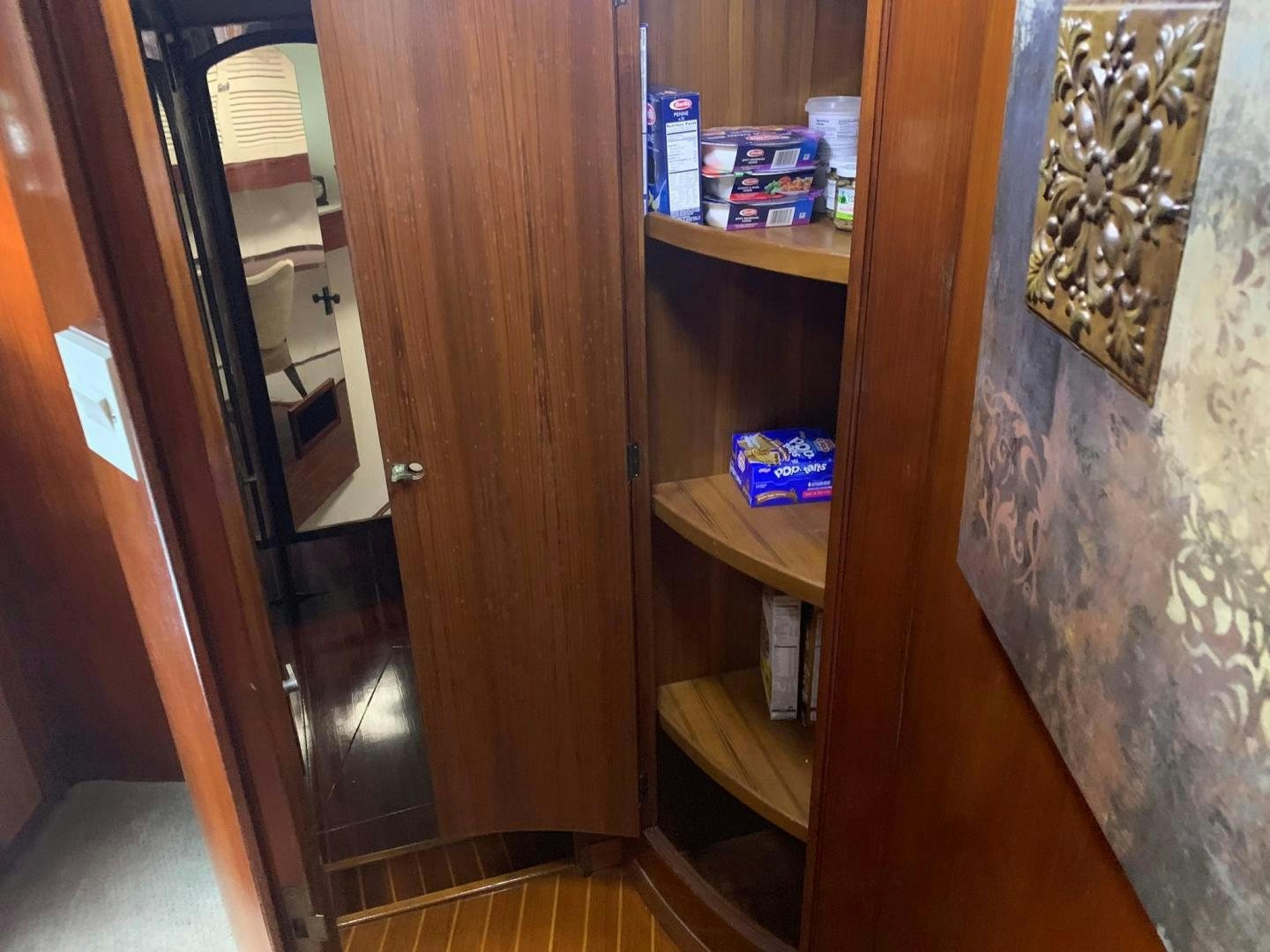 a wooden door with a mirror above it aboard No Name Yacht for Sale