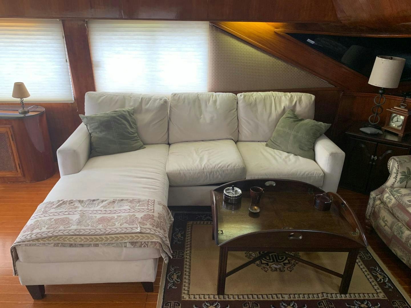 a living room with a couch and coffee table aboard No Name Yacht for Sale