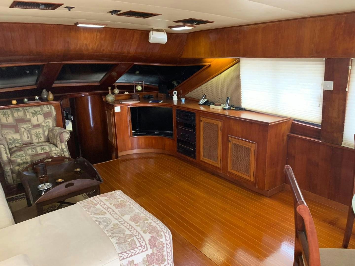a kitchen with wooden cabinets aboard No Name Yacht for Sale