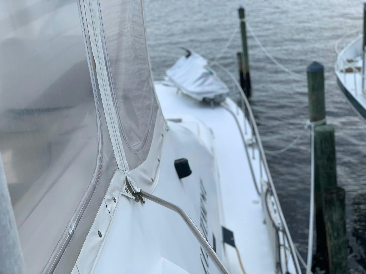 a white boat with ropes aboard No Name Yacht for Sale