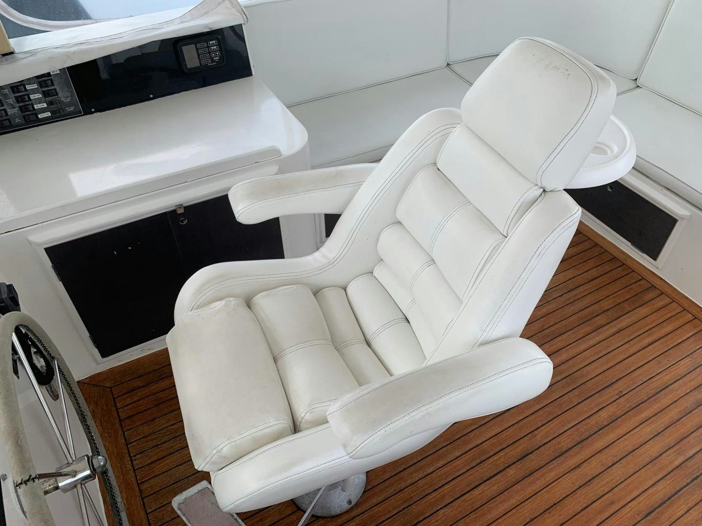 a white chair in a room aboard No Name Yacht for Sale