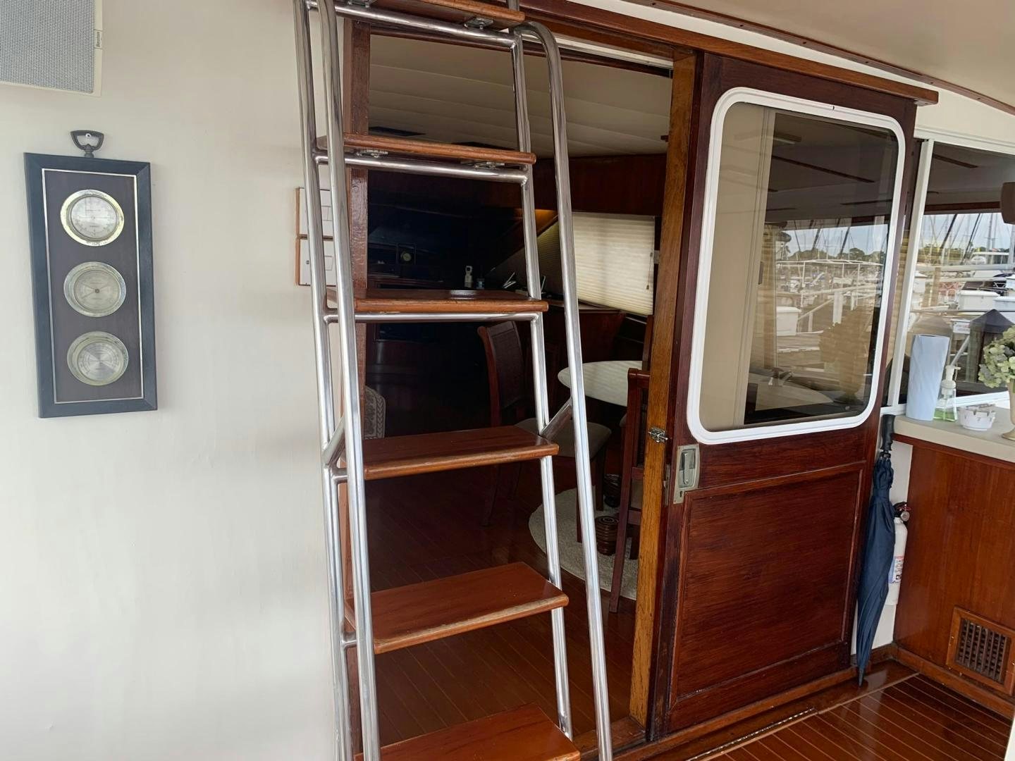a closet with a clock aboard No Name Yacht for Sale