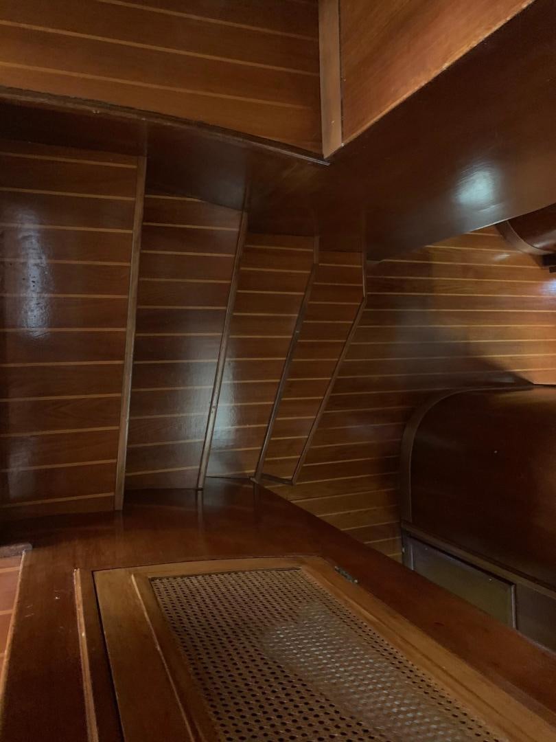 a wooden staircase with a wood floor aboard No Name Yacht for Sale
