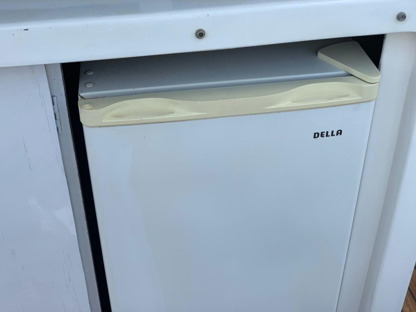 a white rectangular object with a silver handle aboard No Name Yacht for Sale