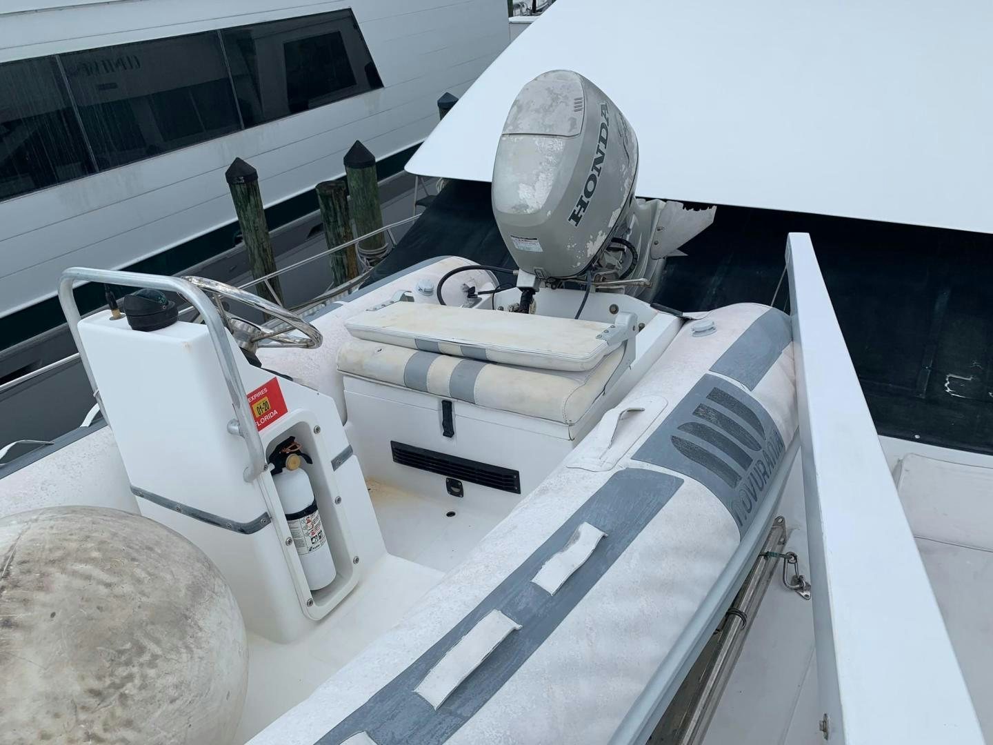 a white machine with a black handle aboard No Name Yacht for Sale