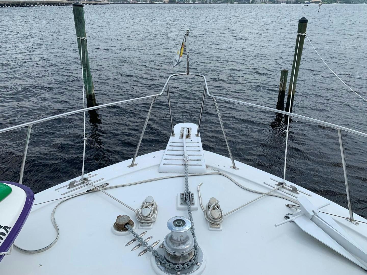 a white boat with ropes and poles aboard No Name Yacht for Sale