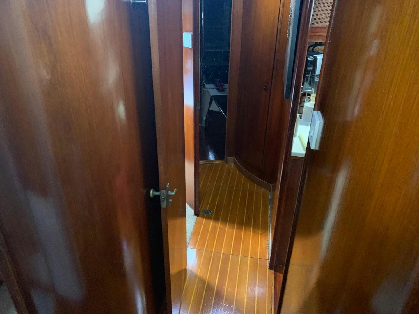 a hallway with a wood door aboard No Name Yacht for Sale