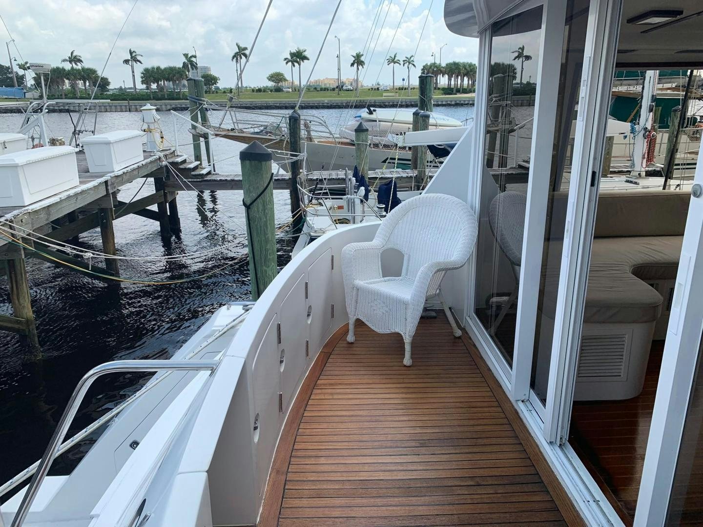 a deck with a chair on it aboard No Name Yacht for Sale