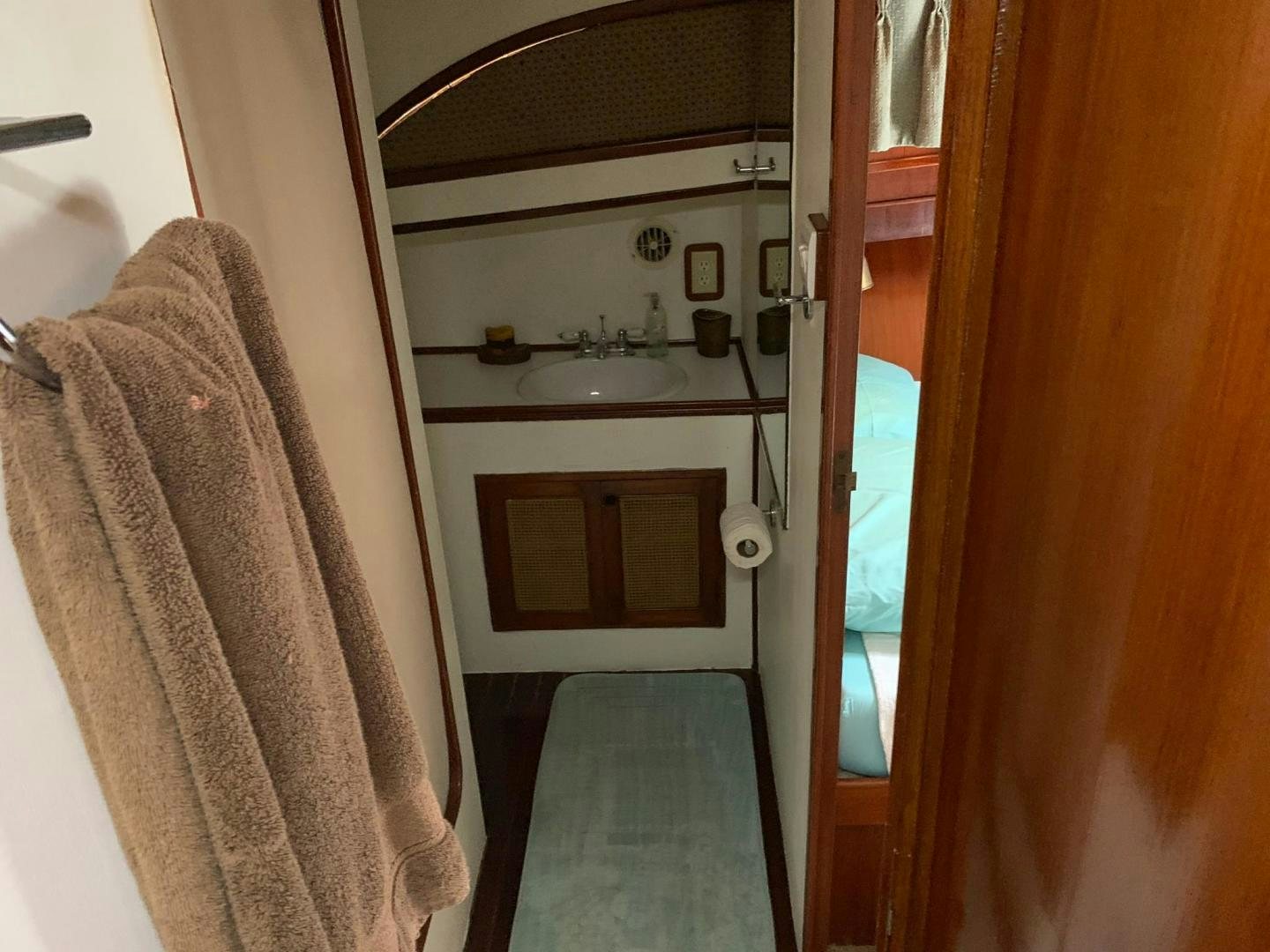 a bathroom with a sink and a mirror aboard No Name Yacht for Sale