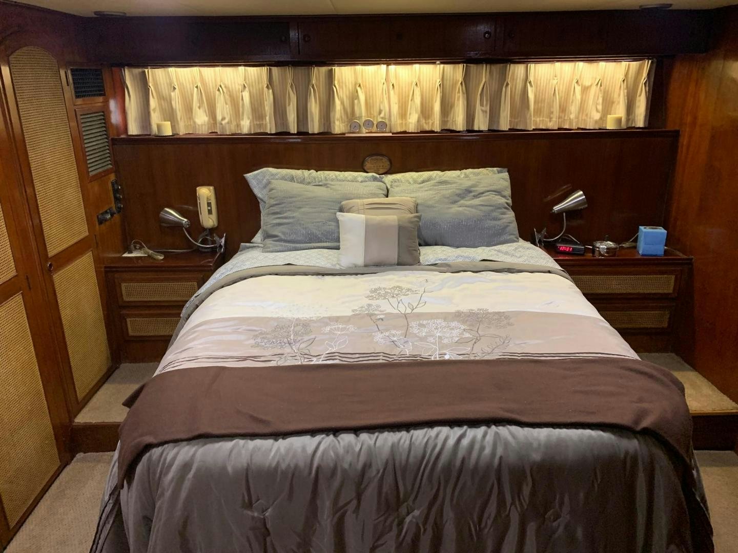 a bed with a white sheet and pillows aboard No Name Yacht for Sale