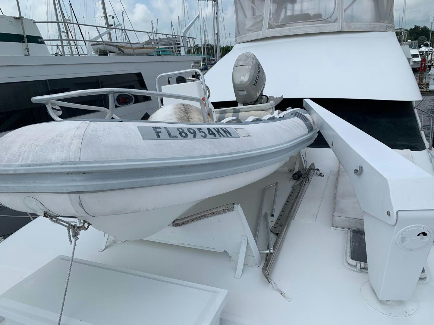 a cat sitting on a boat aboard No Name Yacht for Sale