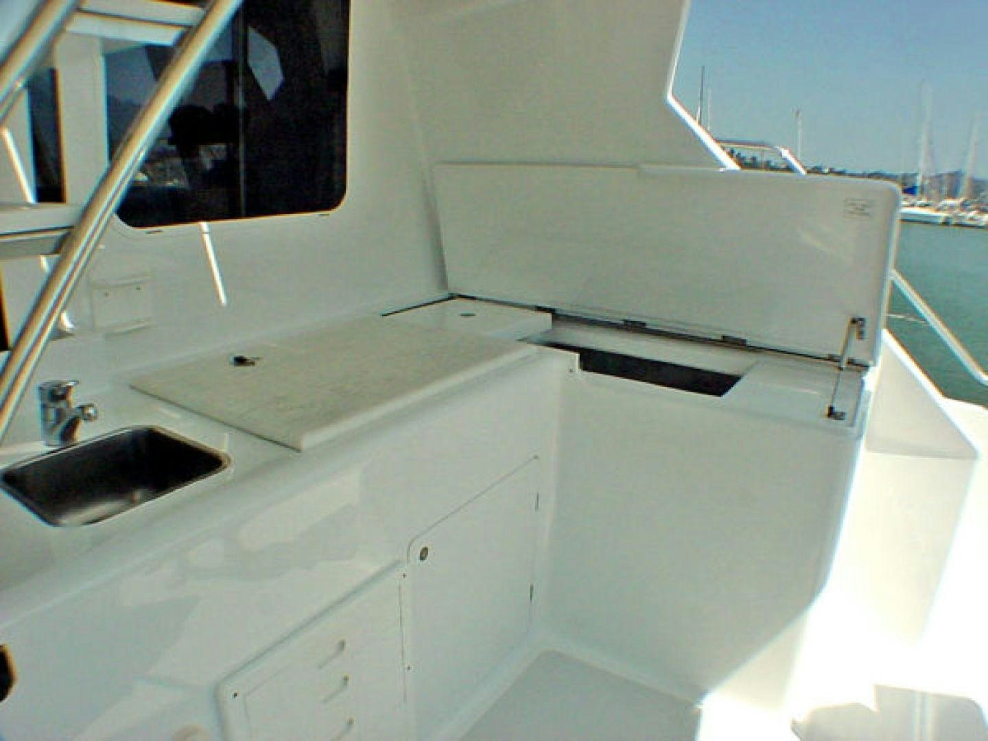 a white boat with a black object on the front aboard O'NEILL Yacht for Sale