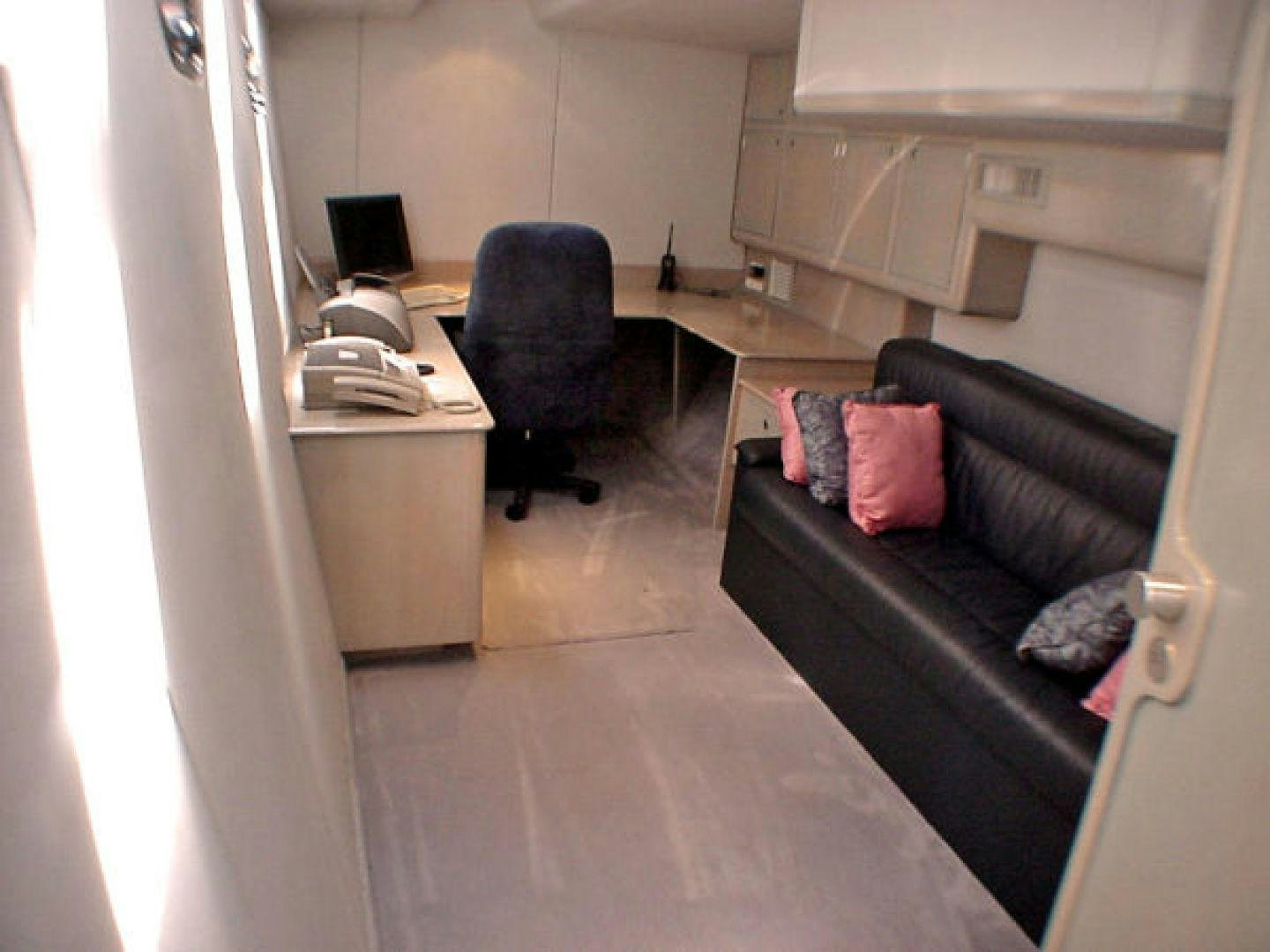 a couch and a chair in a room aboard O'NEILL Yacht for Sale